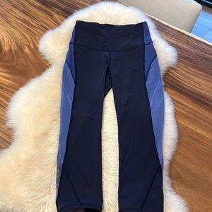 Size 6 blue and light blue Lululemon leggings with mesh on calf and upper leg.